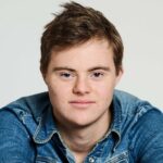 A professional headshot of Noah Matthews, who is the Lived Experience Speaker at the 16th European Supported Employment Conference 